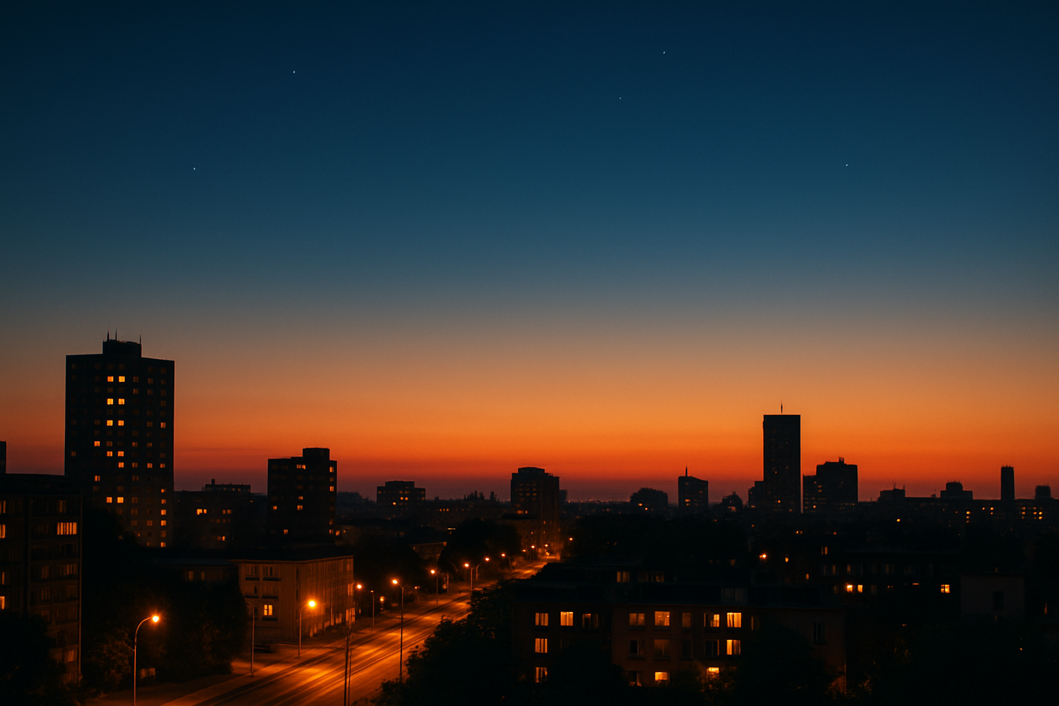 Late June twilight over city lights before full astronomical darkness