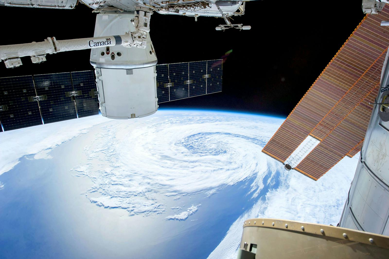 Dragon spacecraft approaches the International Space Station above Earth