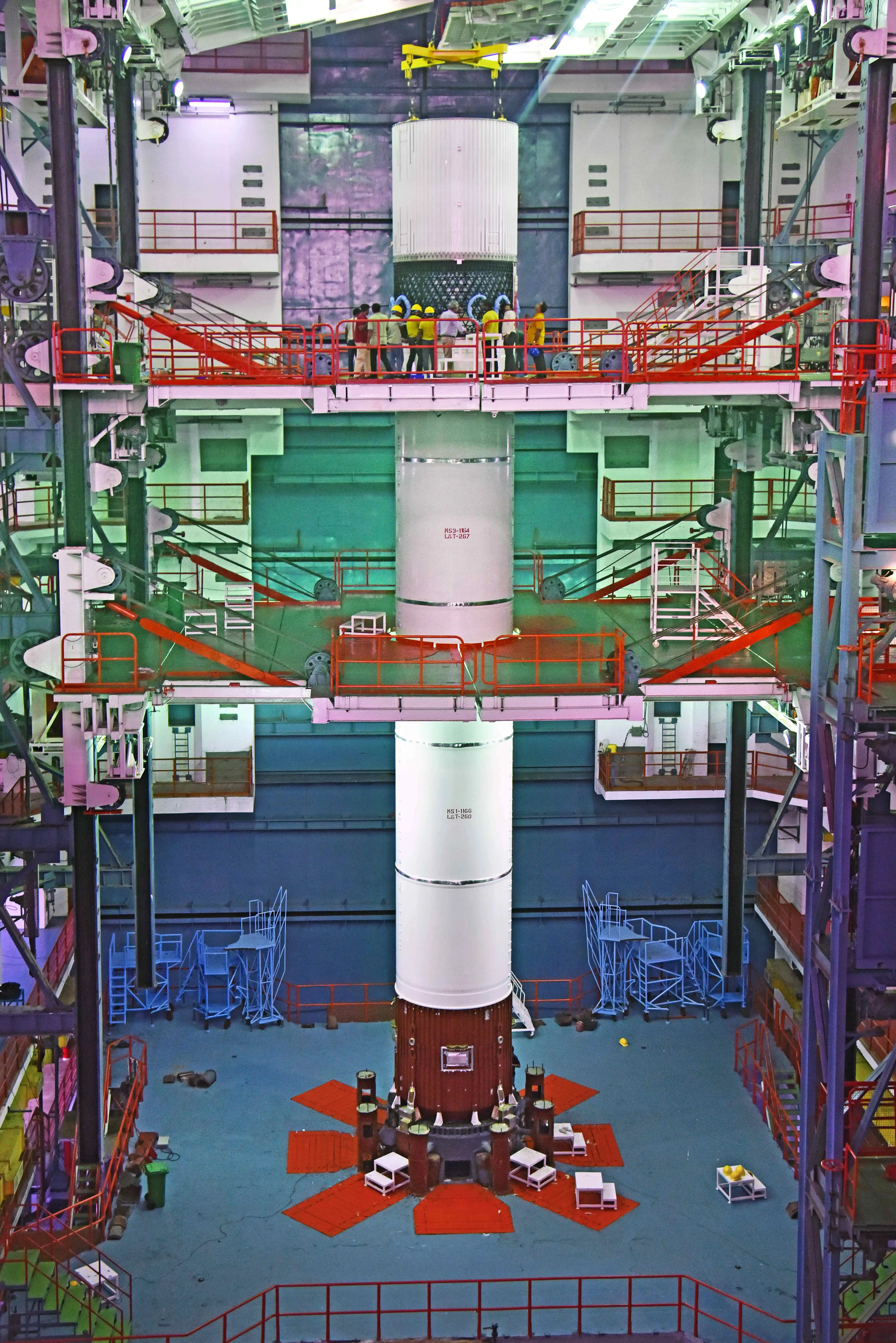 An ISRO team works around the assembled GSLV-F17 vehicle.