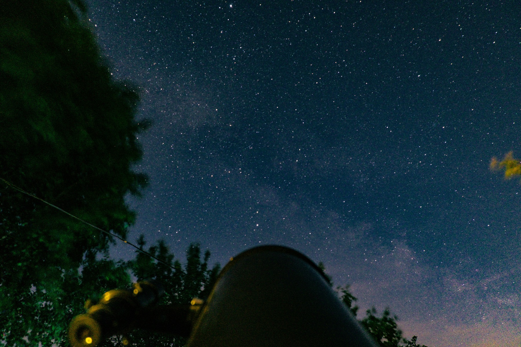 Backyard telescope aimed at a starry sky