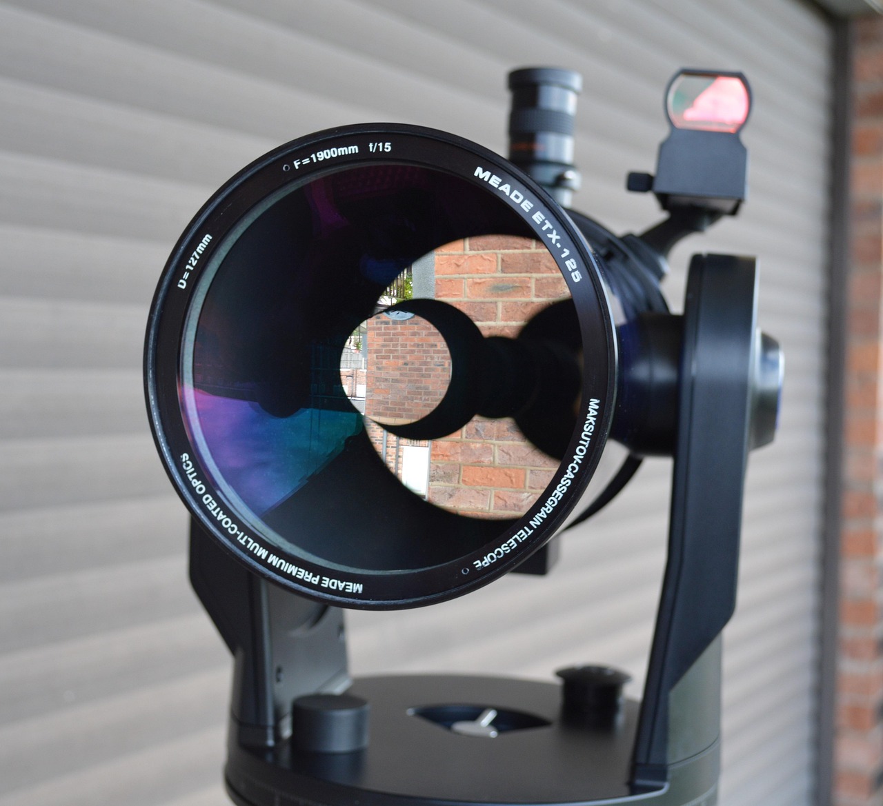 Front view of a Maksutov-Cassegrain telescope showing its corrector lens and central obstruction
