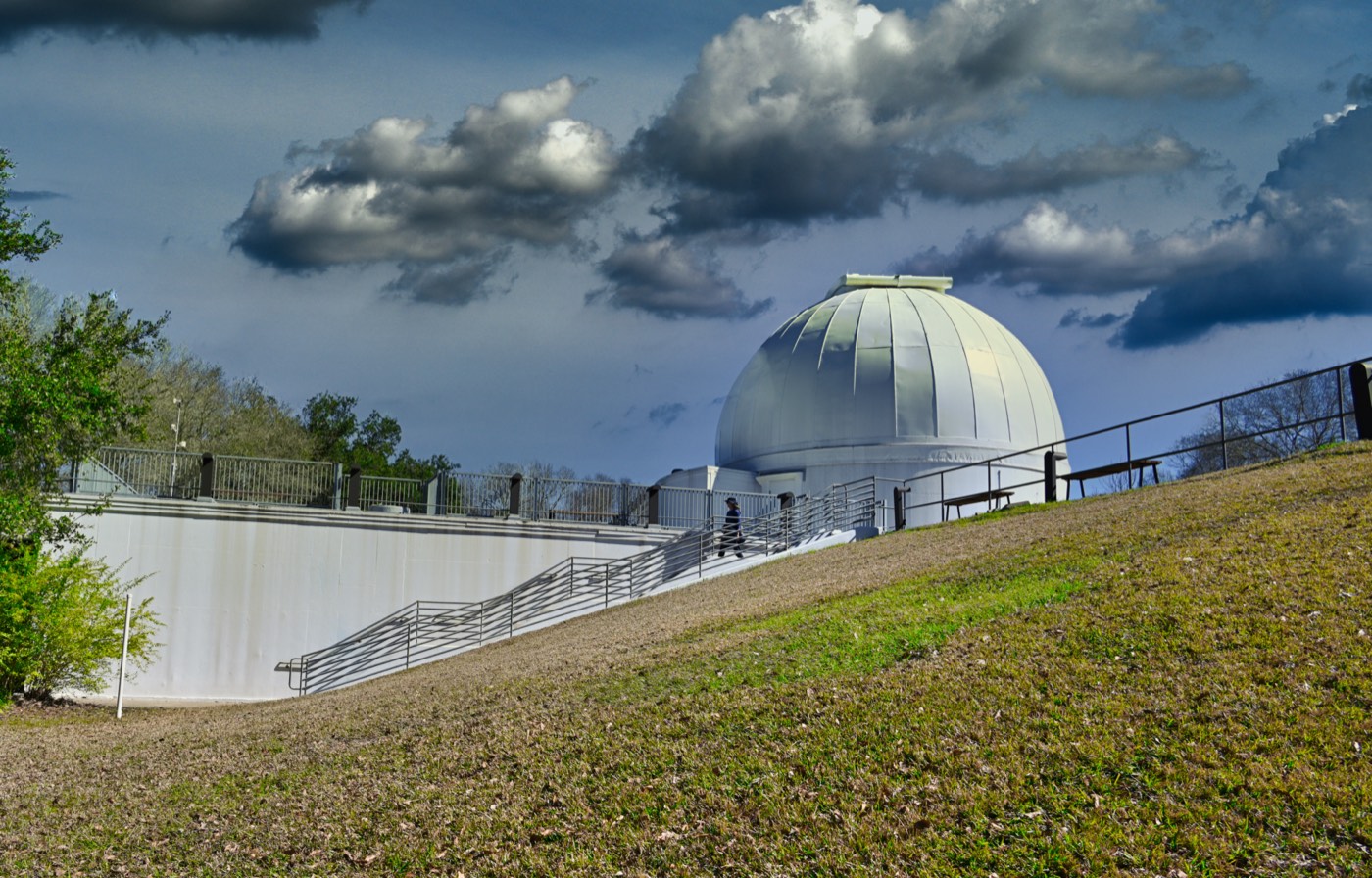 George Observatory dome at Brazos Bend State Park under dark clouds