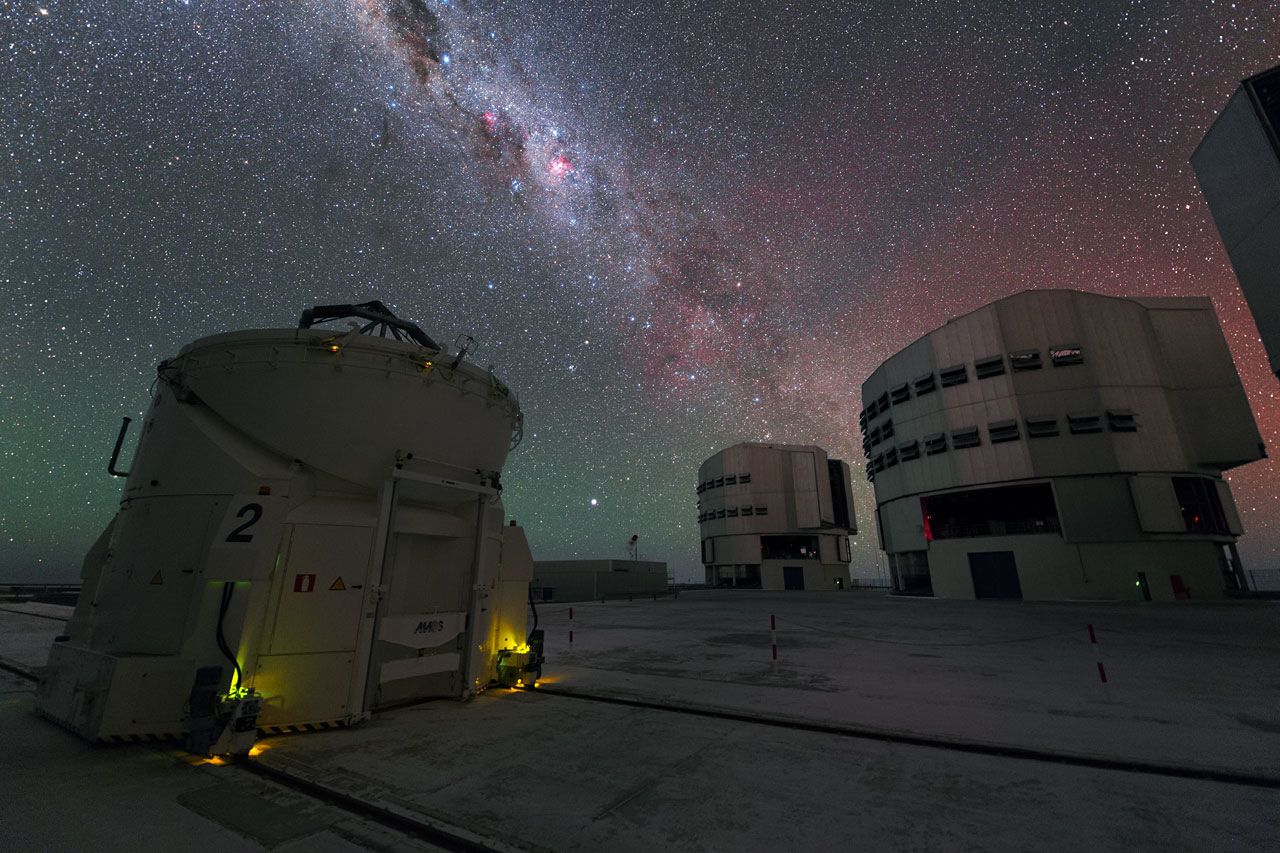 Three VLT telescopes at Paranal Observatory under the Milky Way