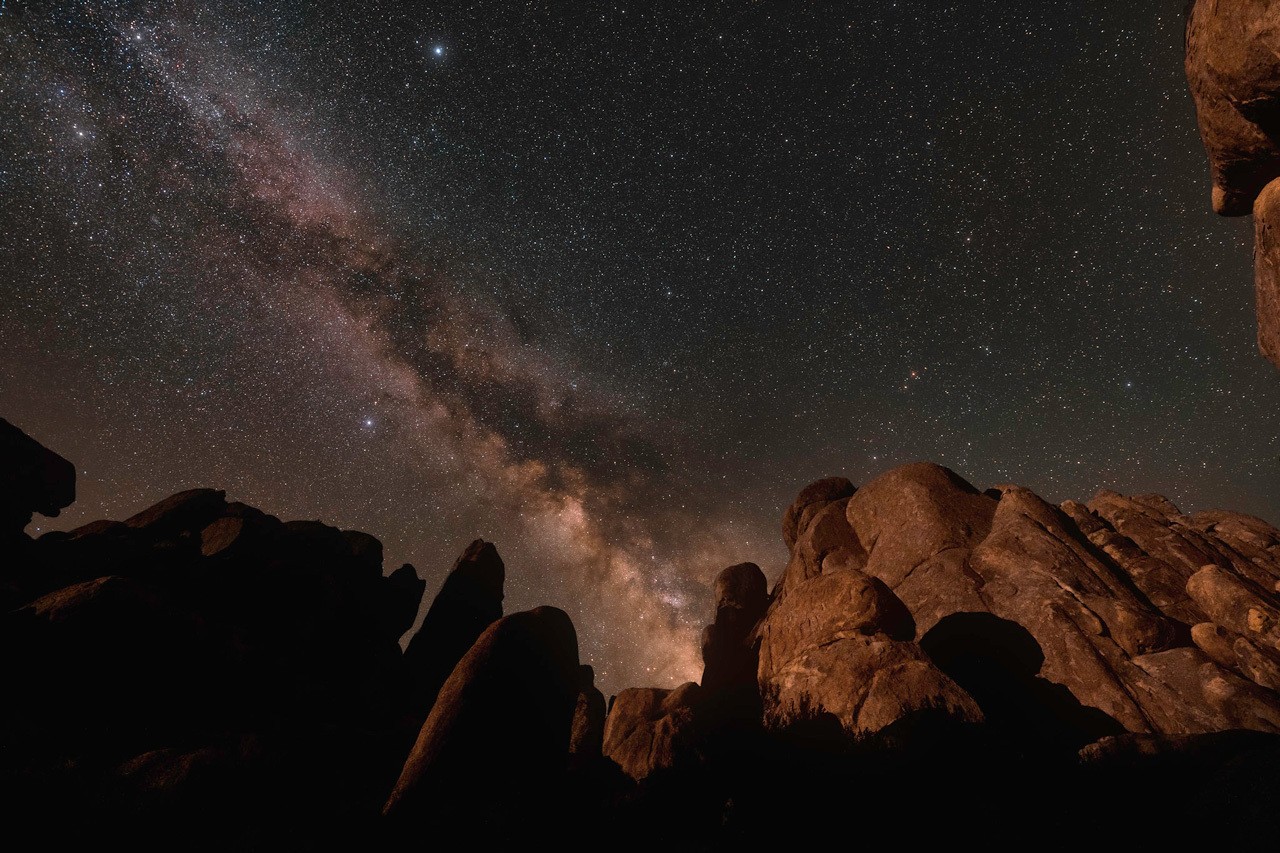 The Summer Triangle hanging above the Milky Way in a wide-field night sky photo