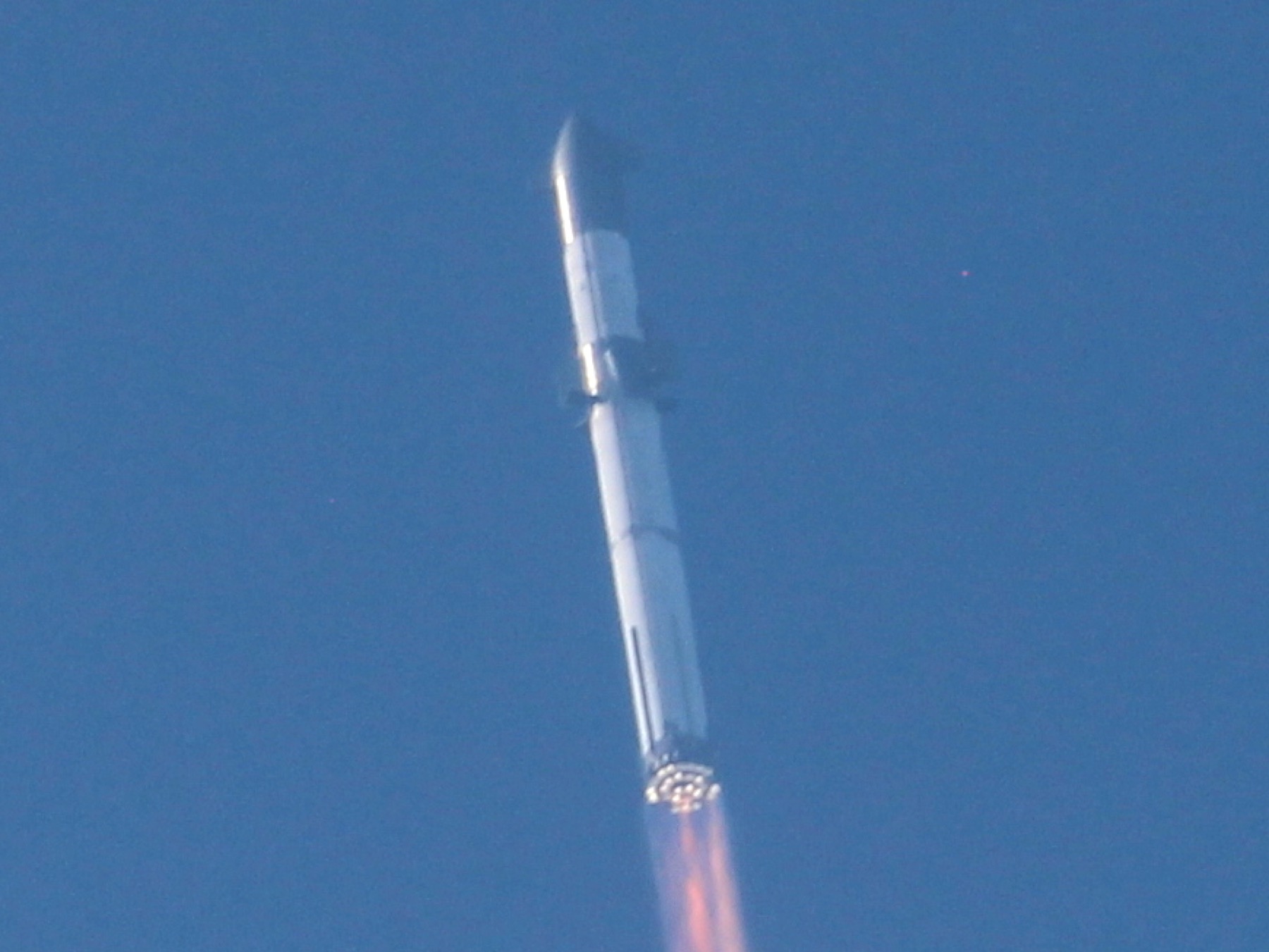 Starship lifting off from Boca Chica during an integrated test flight
