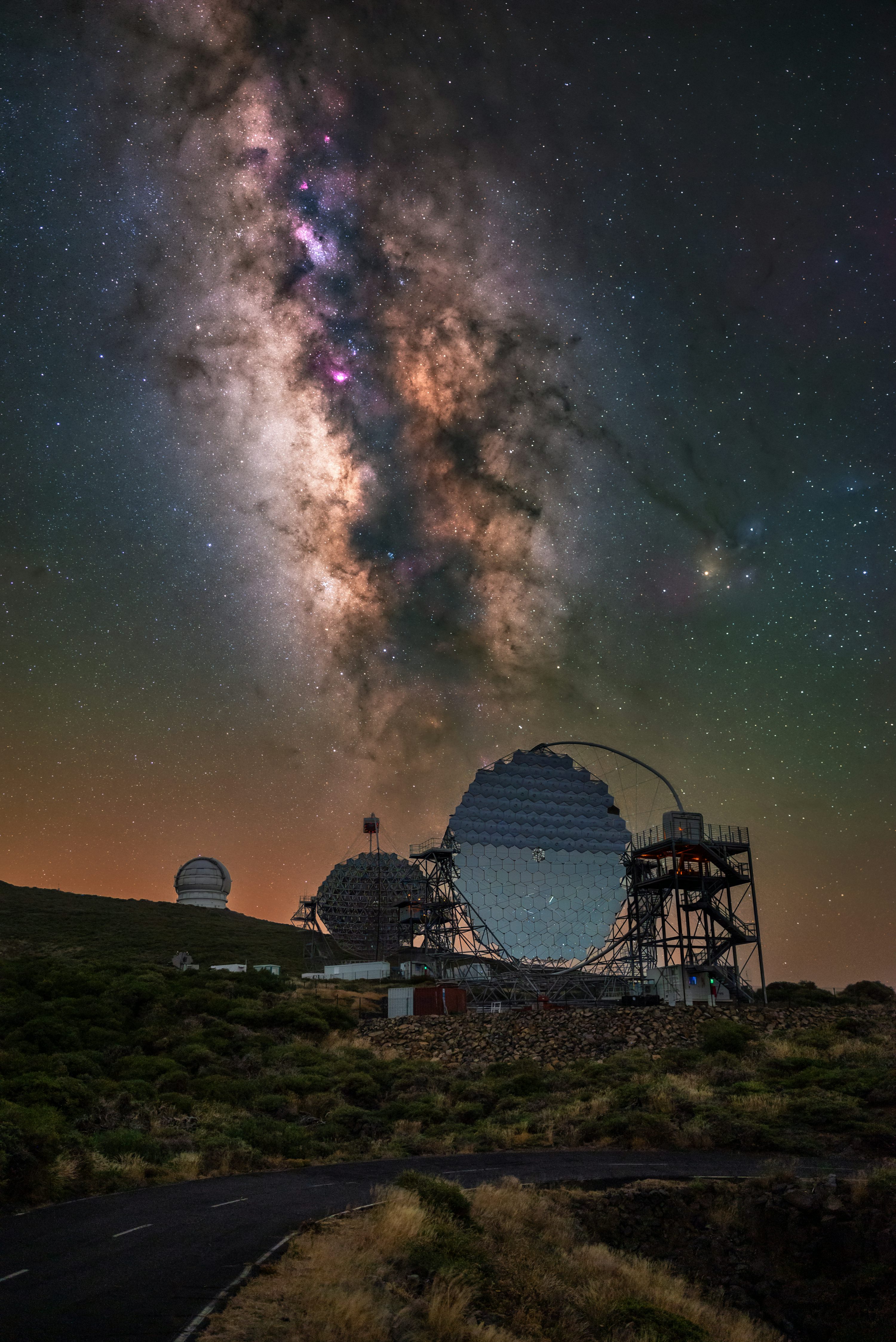 Observatory telescopes under the Milky Way galaxy