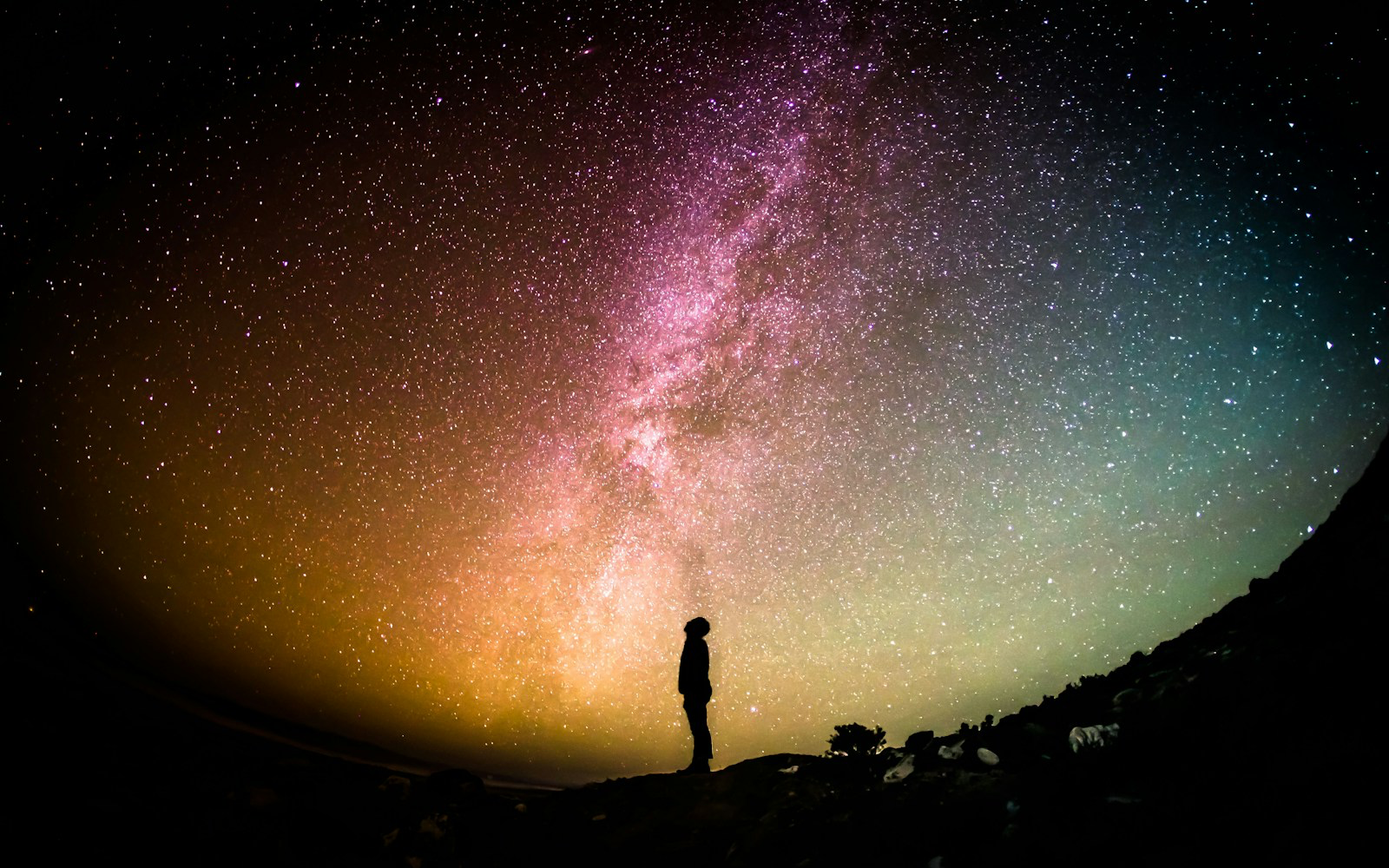 Camera on tripod aimed at a star field